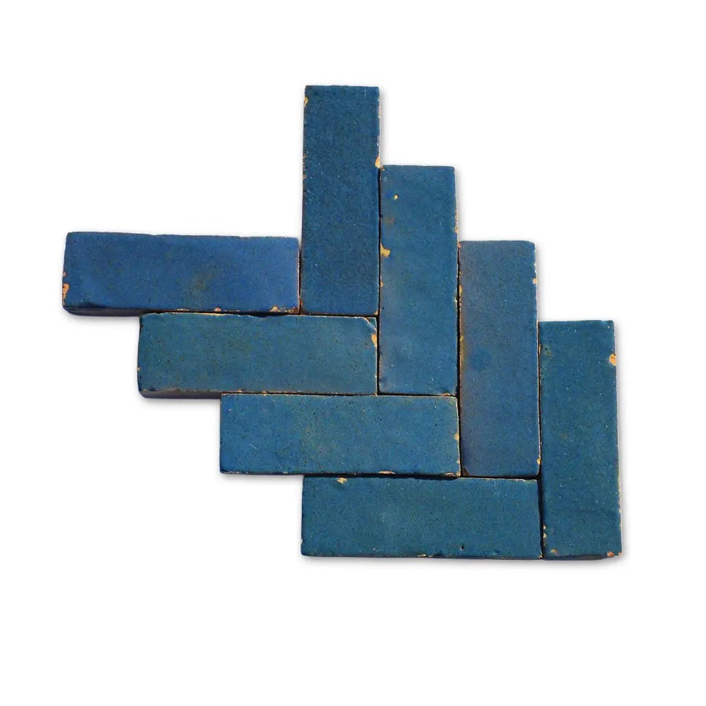 Erfoud Green Grey Bejmat Zellige tiles displayed in a herringbone layout, showing handmade variations.