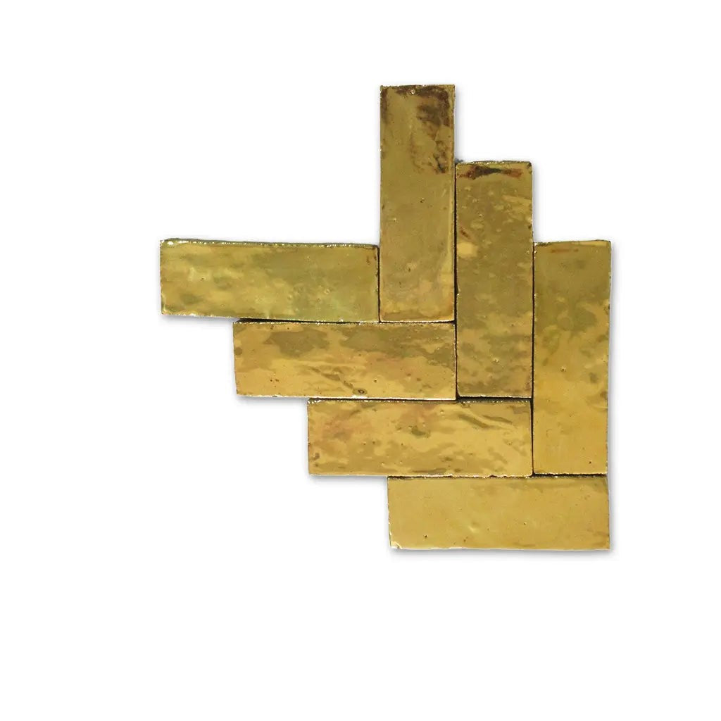 Gold Moroccan Bejmat tiles displayed in herringbone pattern.