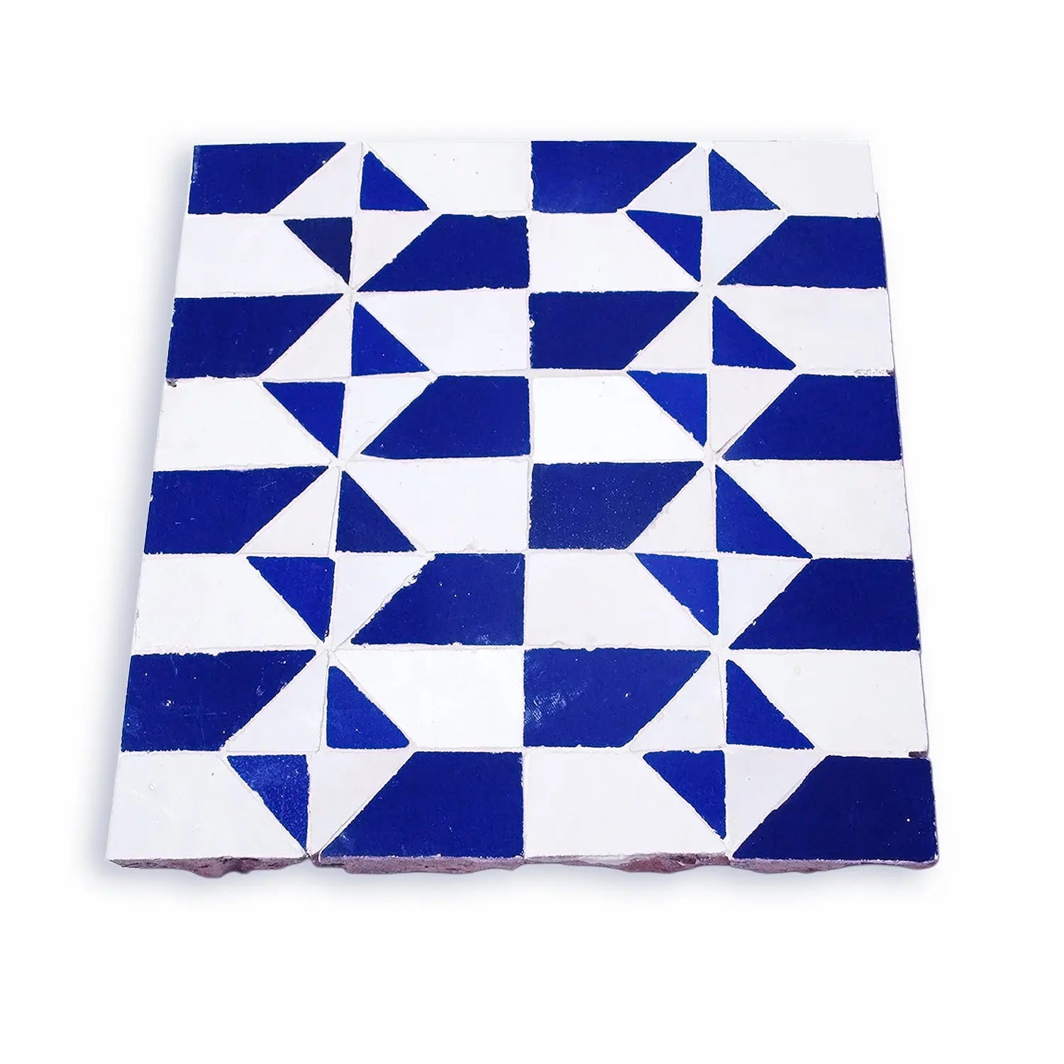 Handmade Moroccan mosaic tile in blue and white geometric design, tilted view