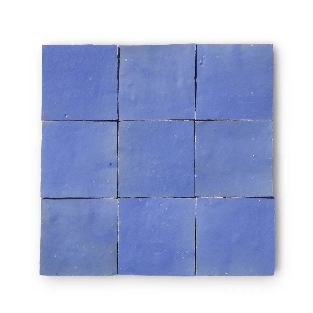 Lavender-blue zellige tile with handcrafted surface and glazed finish. Color variation and texture irregularities are part of its charm. Best suited for indoor wall use.