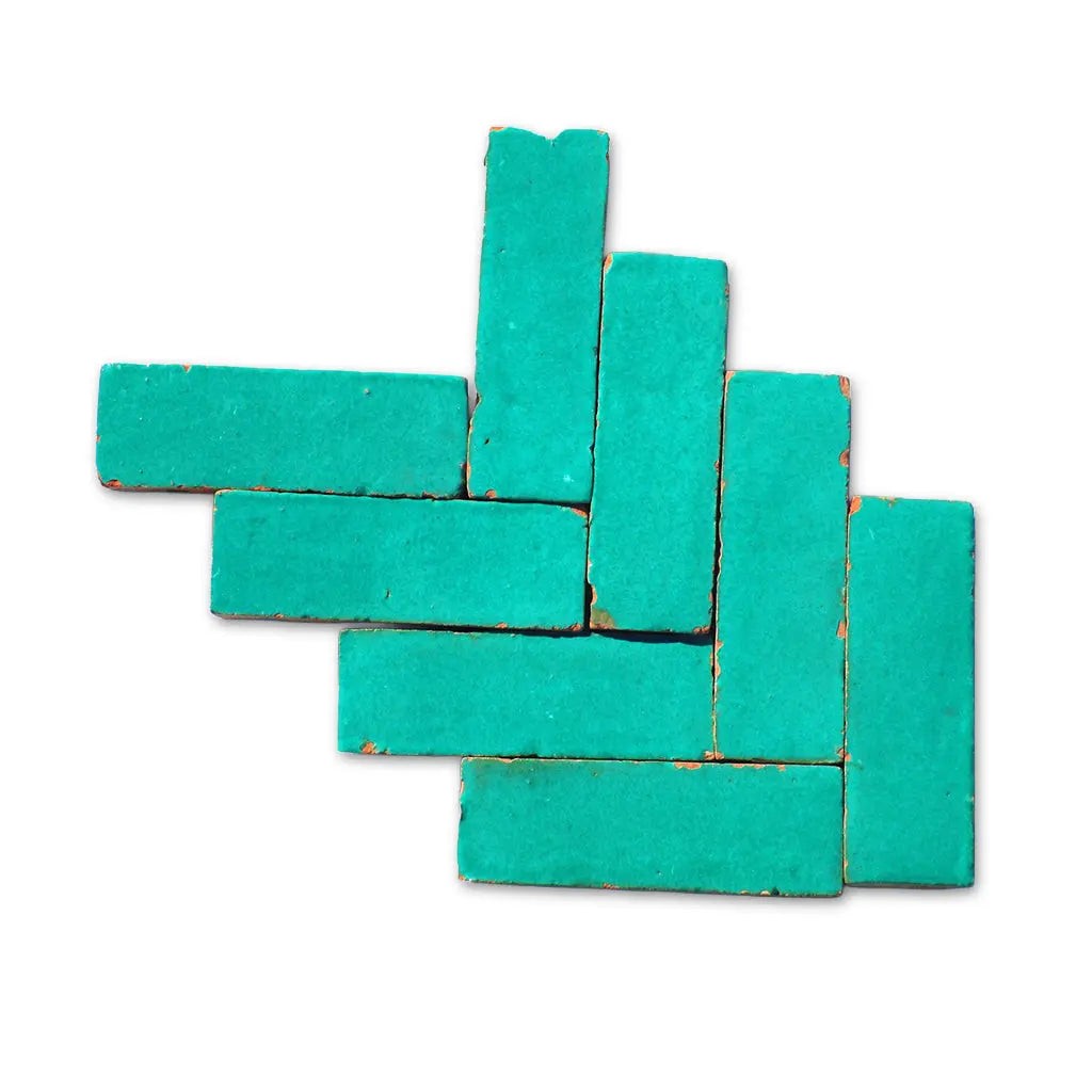 Ouarzazate green Bejmat tiles in herringbone pattern – handmade Moroccan Zellige tiles