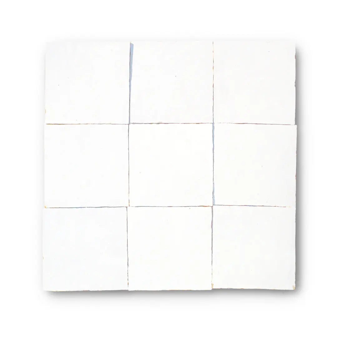 Classic white zellige tile with a handcrafted glazed surface. Slight tonal and edge variations. Recommended for interior wall use.