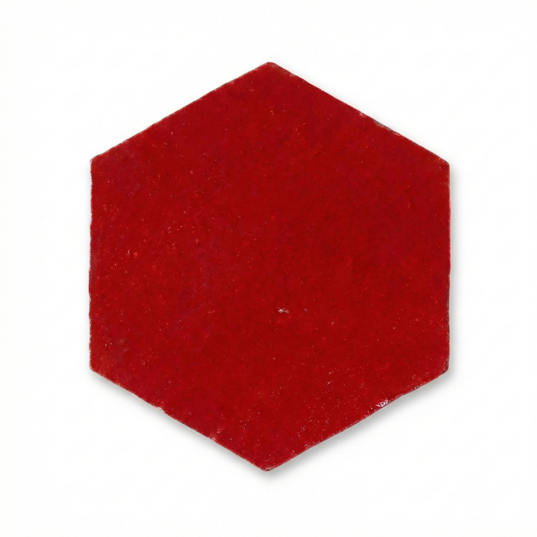 Hexagonal red felt patch on a white background