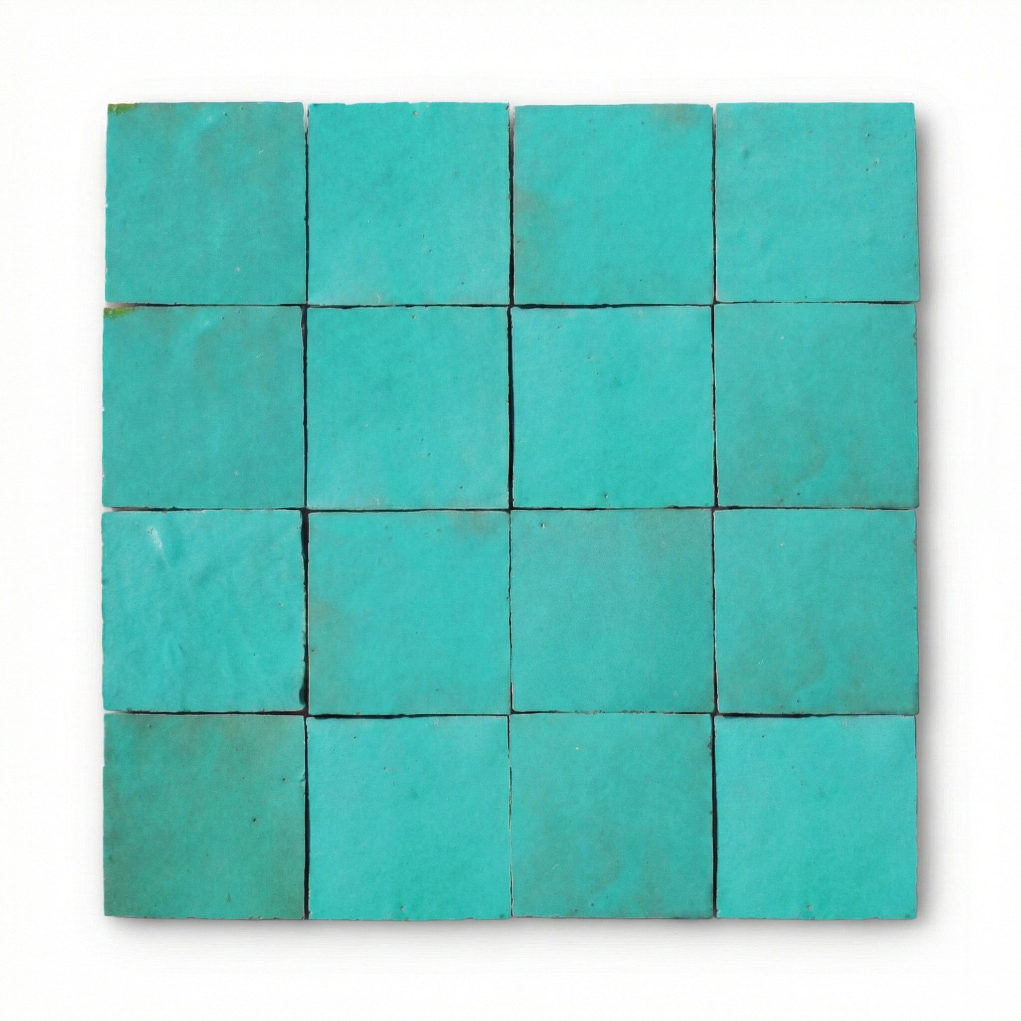 Al Hoceima Mint Green Zellige tiles, 10x10cm handcrafted Moroccan mint green terracotta wall tiles with a glossy, reflective finish.