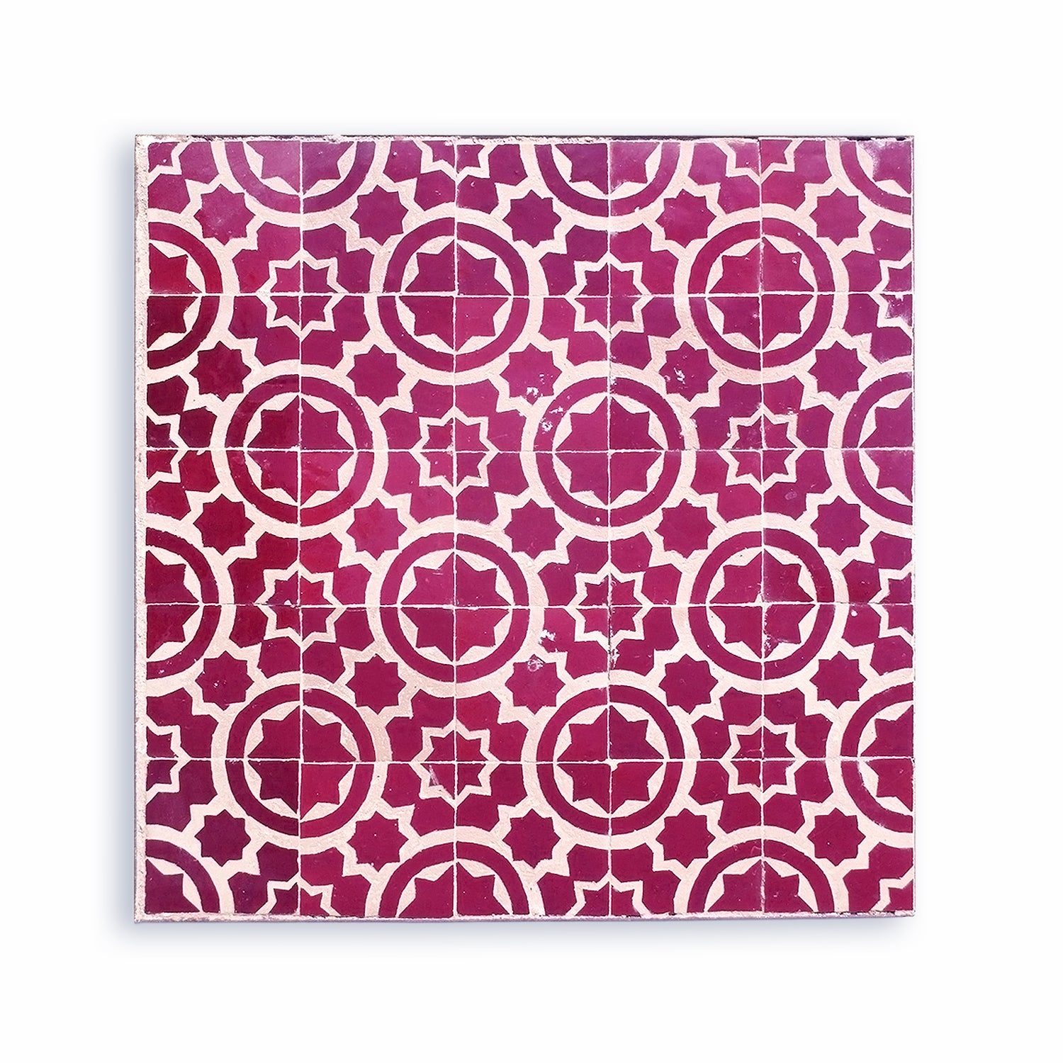 Shop the Granada Red Star, an authentic chiseled zellige tile from Zelligerar. Handcrafted in Tétouan with a deep red glaze & geometric star pattern.