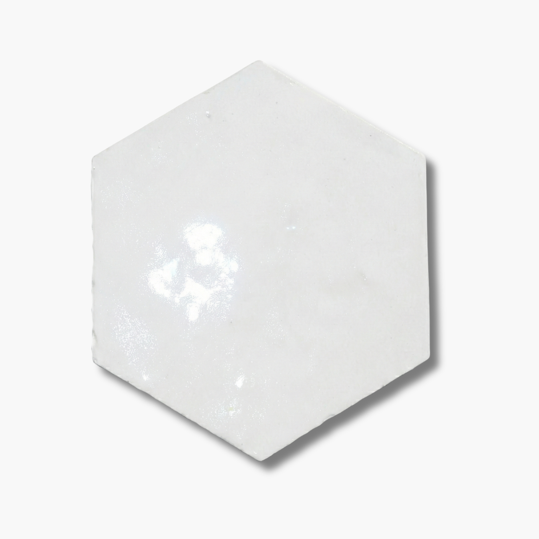Hexagonal white ceramic tile on a white background