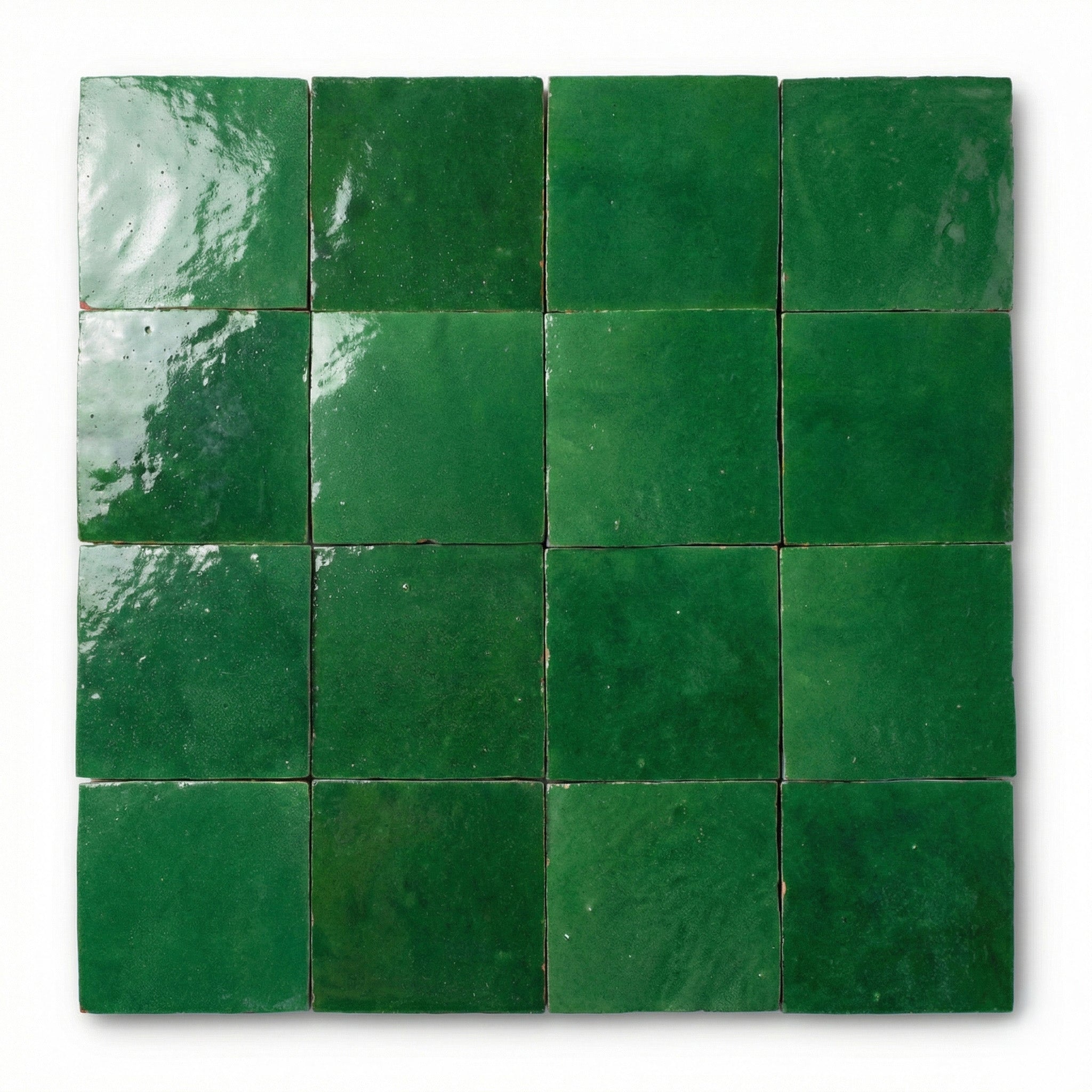 Nador Grass Green Zellige tiles, 10x10cm handcrafted Moroccan grass green terracotta wall tiles with a glossy, reflective finish.