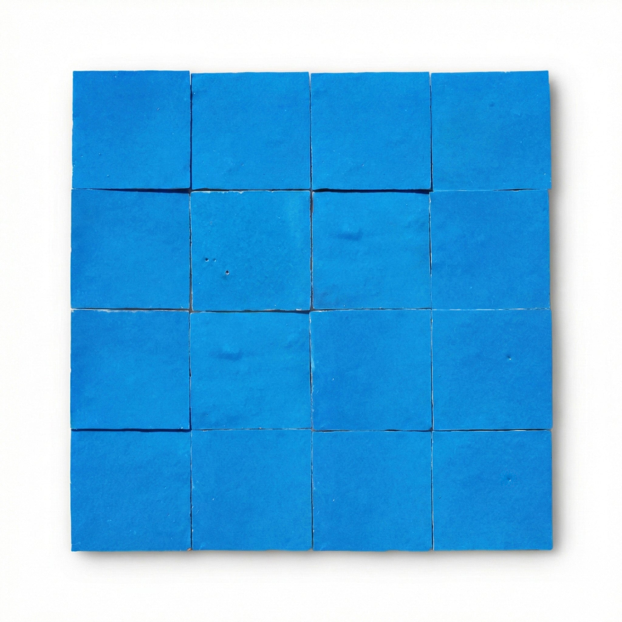 Tetouan Blue Zellige tiles, 10x10cm handcrafted Moroccan cobalt blue terracotta wall tiles with a glossy finish.