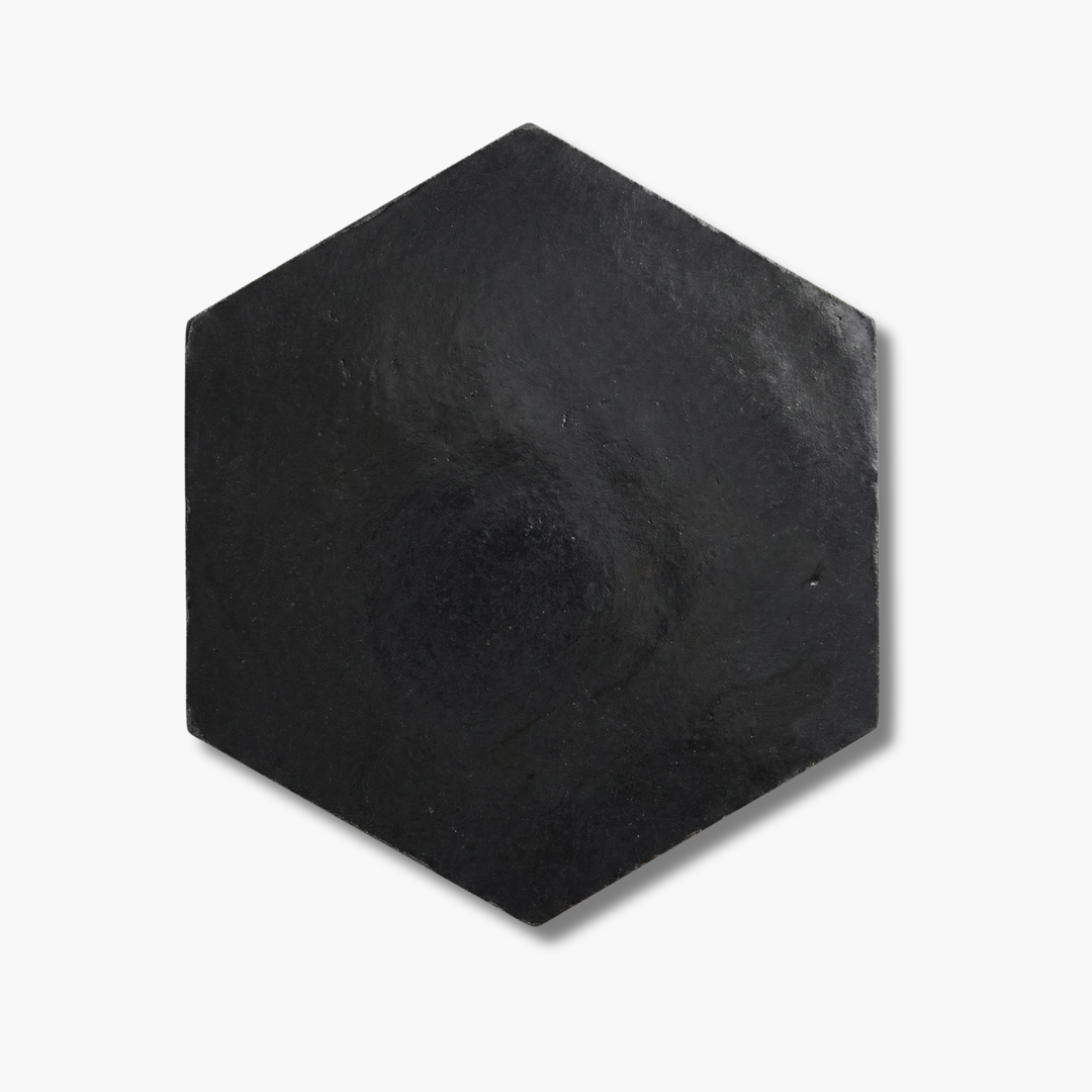 Hexagonal black stone on a white background